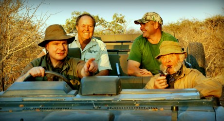 Director driving with Guy Wallace and safari hunters